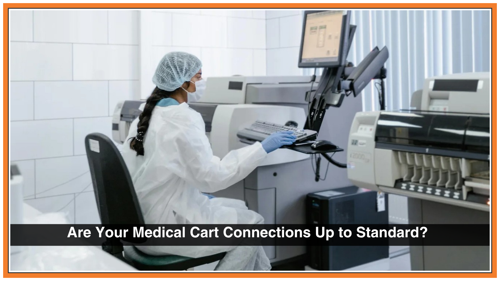Picture of a medical tech sitting at a computer station in a room with medical equipment.